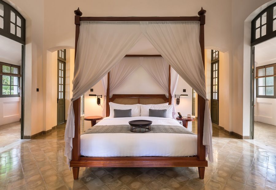Canopy bed in a luxury resort suite booked through Victoria Tour luxury travel