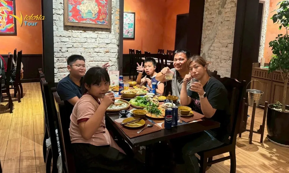 Family enjouying Vietnamese food during a Vietnam family holiday