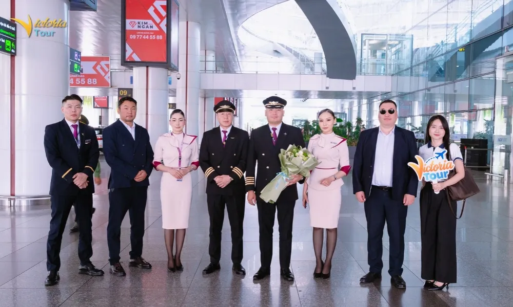 Victoria Tour representatives coordinate arrangements for the Mongolian group at the airport in Vietnam.