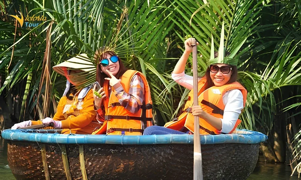 Travelers enjoying a traditional basket boat ride in Cam Thanh, Hoi An, Vietnam