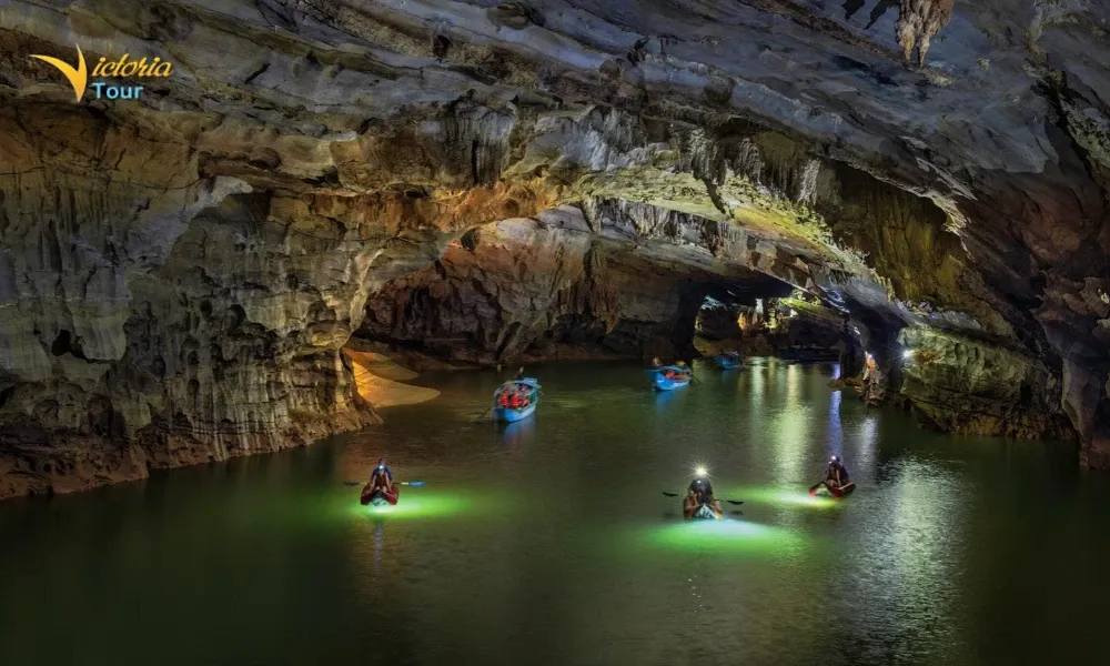 Visitors exploring a cave in Phong Nha, Central Vietnam