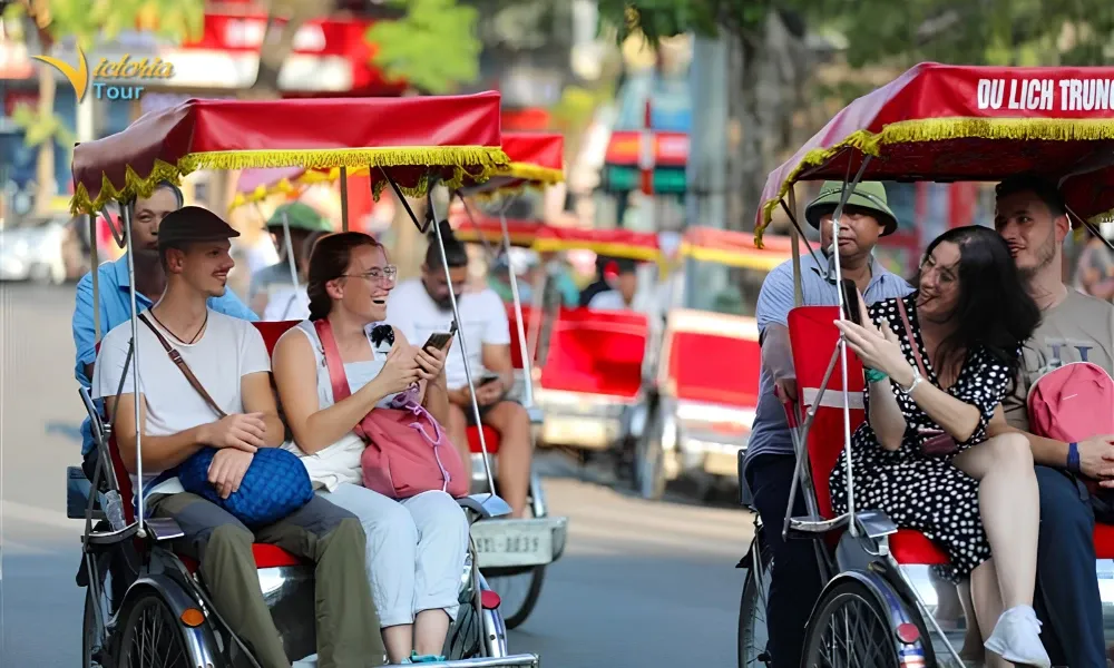 foreigner explore Hanoi street through Vietnam Cultural Tours