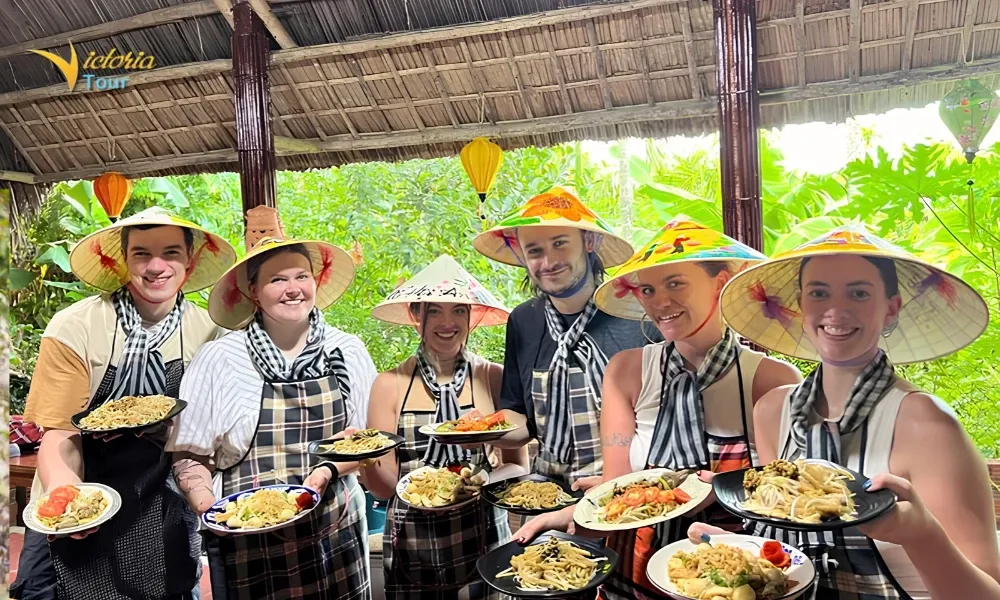 Travelers learning Vietnamese food culture during a local cooking class